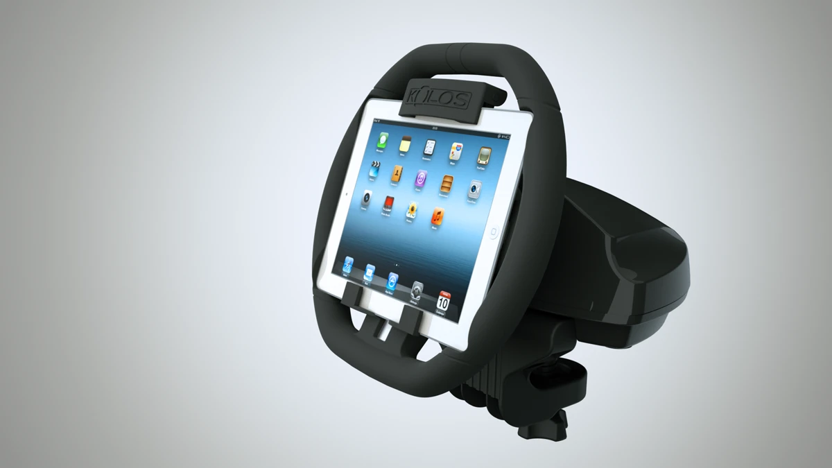 The KOLOS attaches to an iPad and turns it into a steering wheel for racing games, complete with a detachable base that attaches to most surfaces