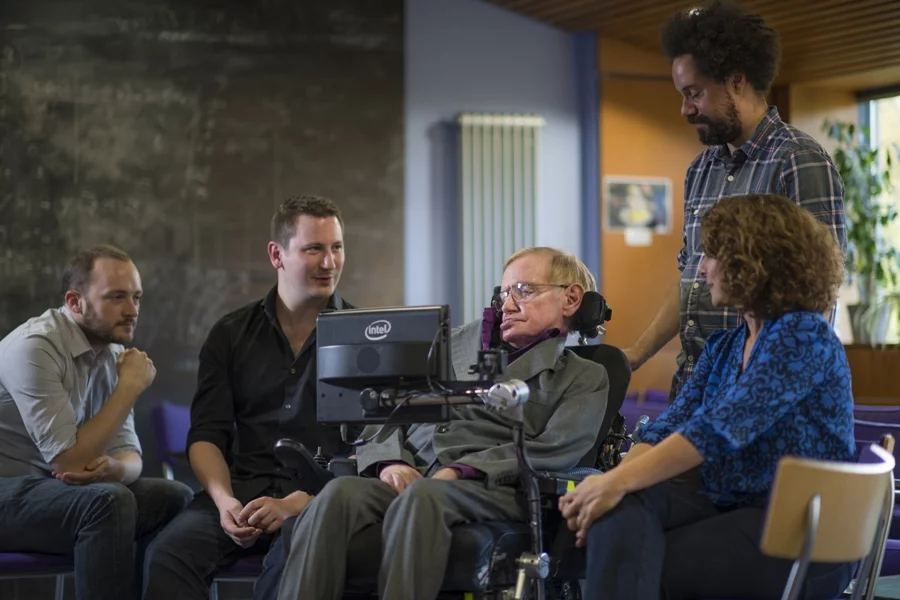 Professor Stephen Hawking with the team who worked on his new Intel-powered communications system: (left to right) Steven Spencer, SwiftKey; Joe Osbourne, SwiftKey; Jonathan Wood, Hawking's personal assistant; and Lama Nachman, Intel