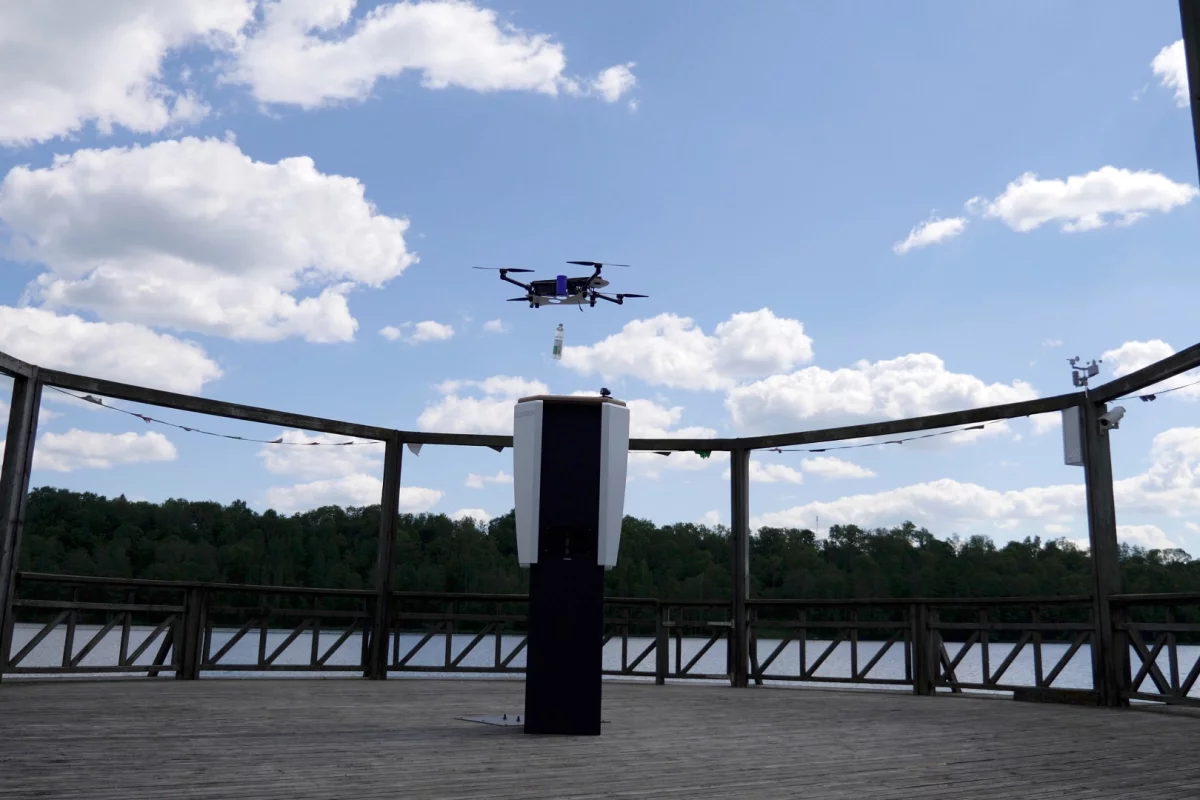 A quadcopter drops a bottled beverage into the CleverNest