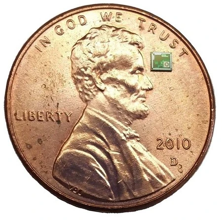 The ATOMS chip is 250 times smaller than a penny, as seen here