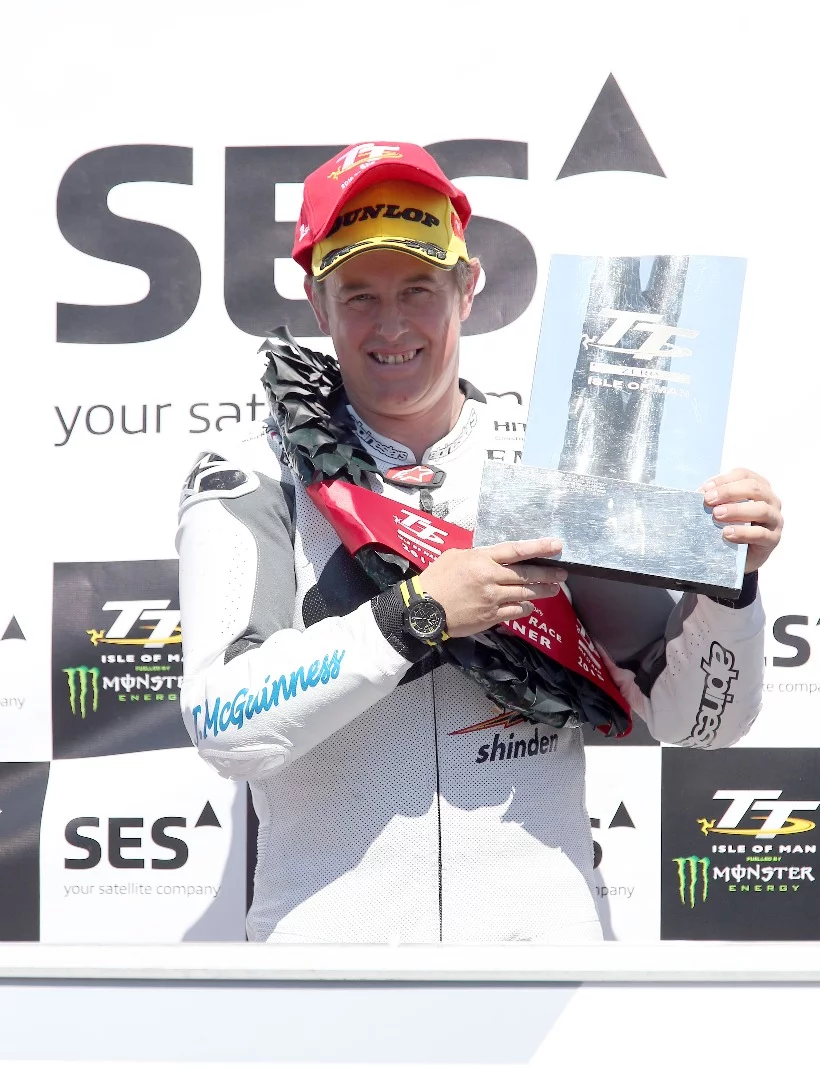 John McGuinness celebrates his 22nd Isle of Man victory, just four shy of Joey Dunlop's record