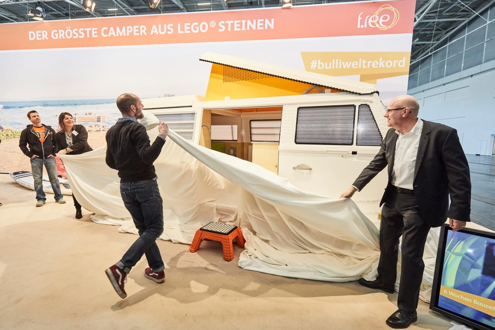 Pulling the cloth off the impressive "Brick Camper"