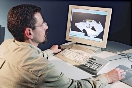 Mercedes Benz designers working on computer simulations of the next generation roof.