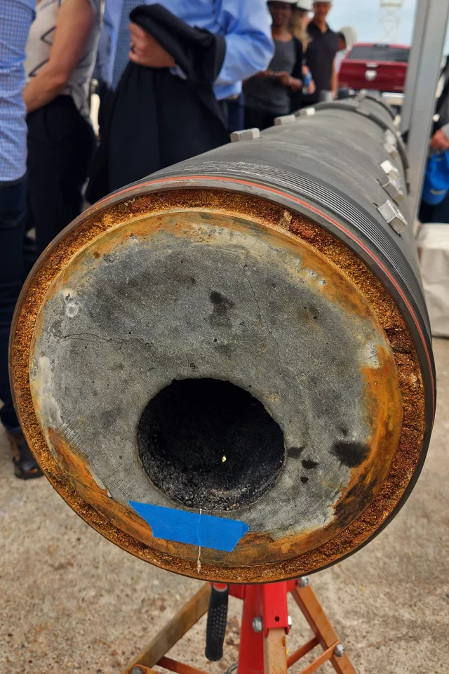 Quaise dug a plug out of the ground from its first millimeter wave drilling session. You can see the vitrified walls of the bore