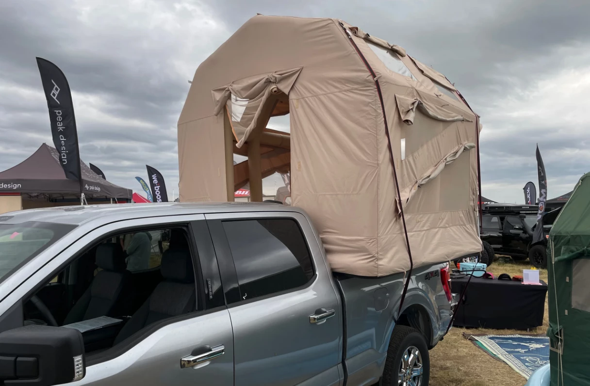 A different style of truck camper that camps on top of the bed walls, not in the bed or on a roof rack