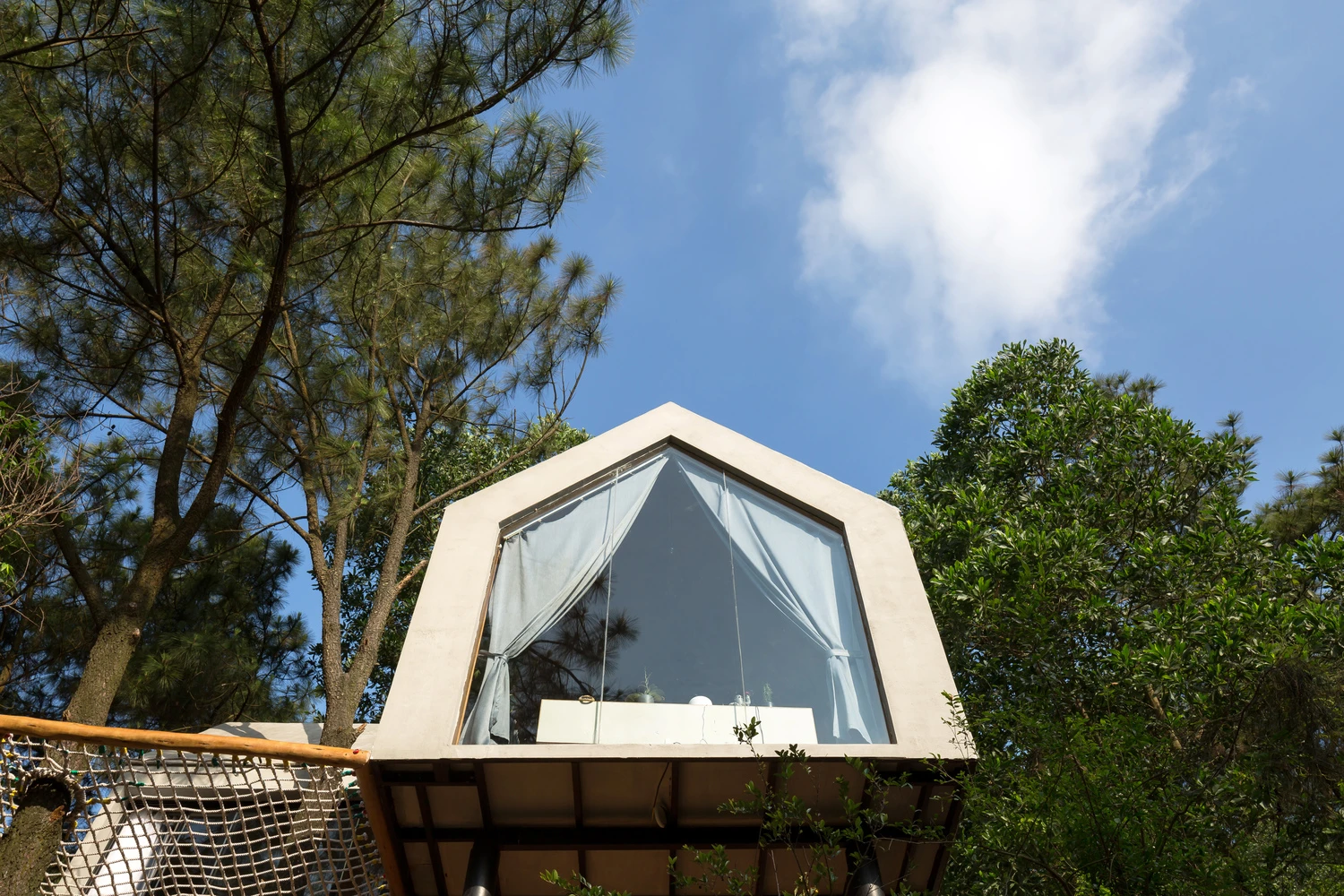 Forest House 02 is a tiny house that resembles a treehouse
