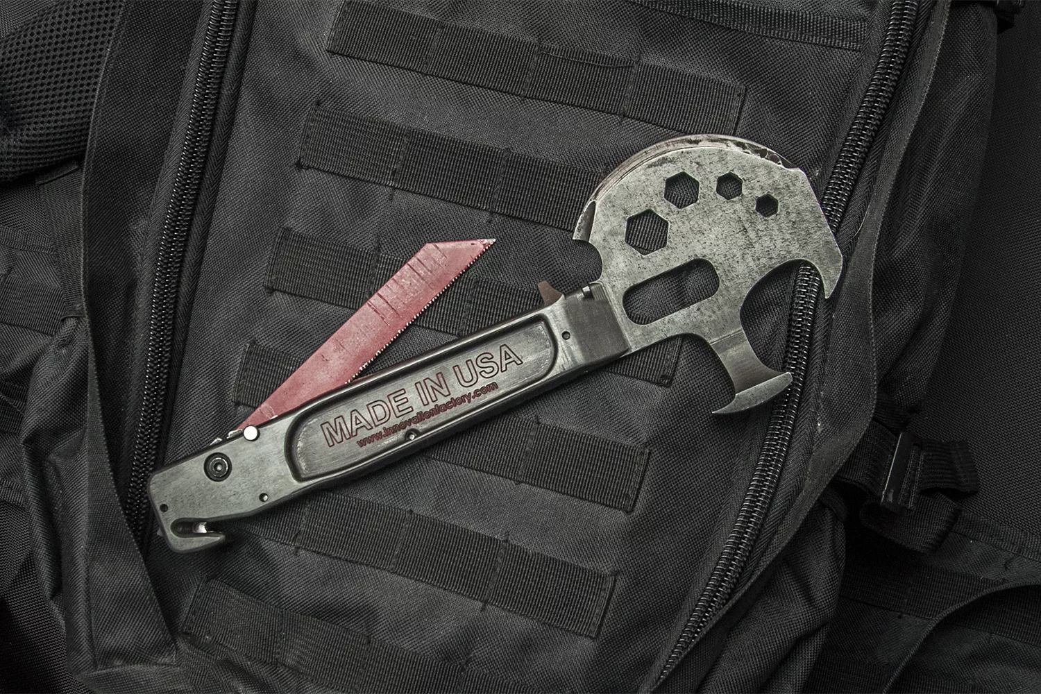 The Lil Trucker multitool includes an extendable saw for cutting through wood