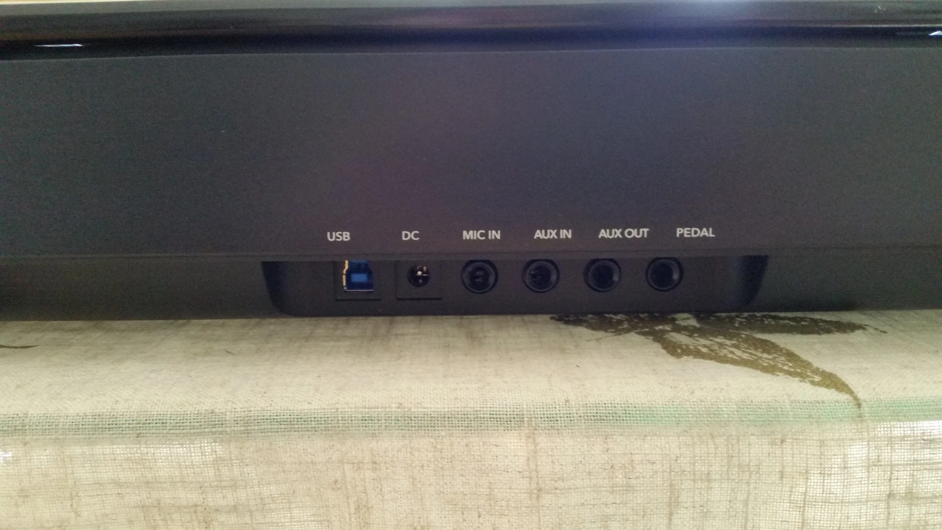 The back of the One Smart Light piano with multiple plug-ins