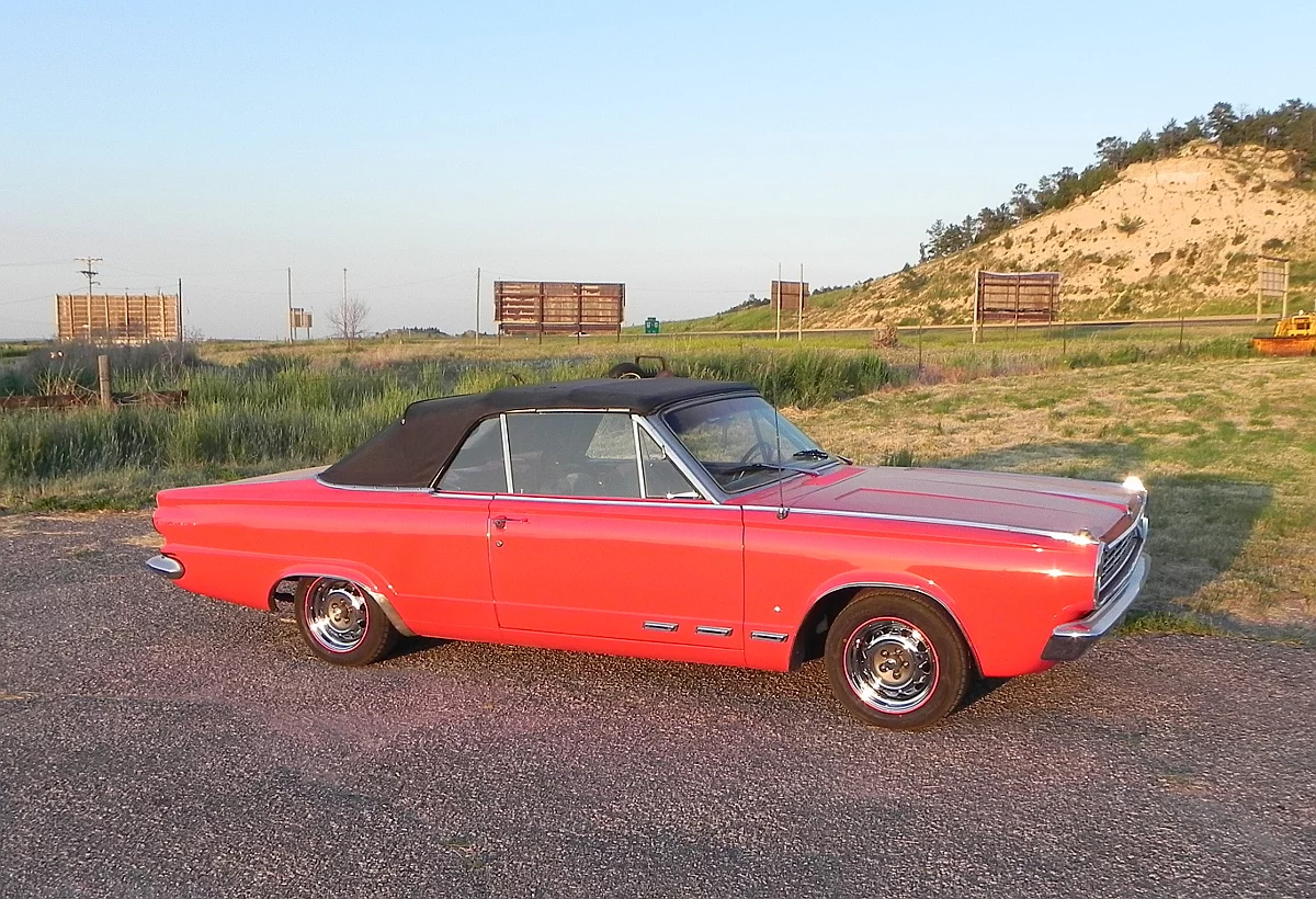 Shadows help draw out the contrasts in color on the Dart, with its black top, chrome accents, polished wheels, and new red RimBlades