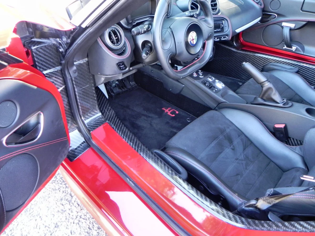 Getting into the Alfa Romeo 4C is a matter of putting one foot into the floorpan, pointing one's derriere in the general direction of the seat, and falling in