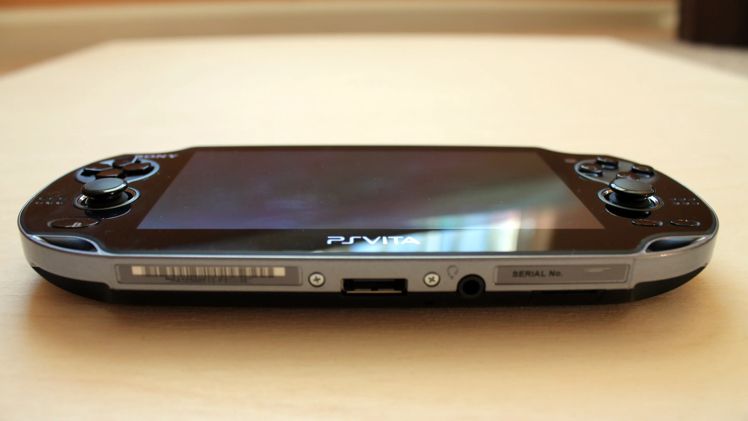 The original Vita includes a proprietary charging port, while the new version (Japan only for now) supports microUSB chargers