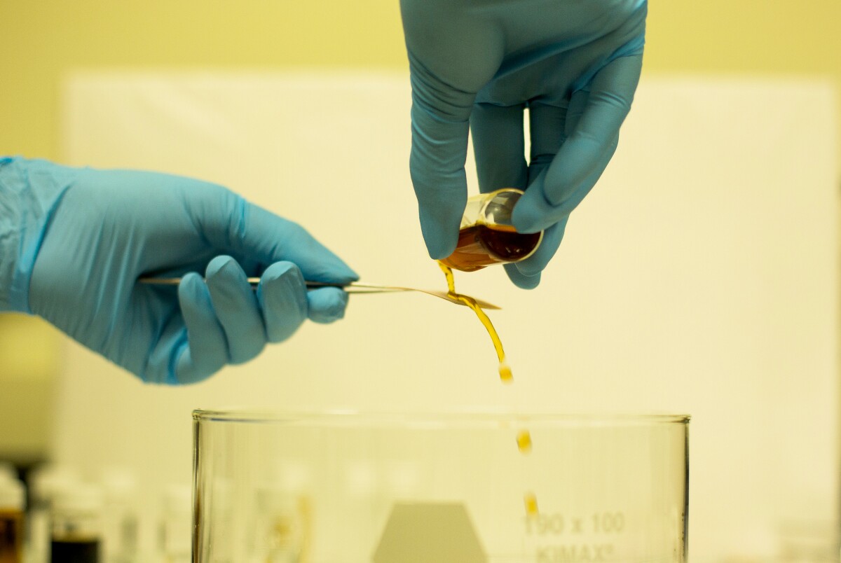 Coffee running off a piece of fabric treated with the new nanoscale coating (Photo: Joseph Xu, Michigan Engineering Communications & Marketing)