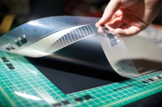 Two sheets with a layer of pressure sensitive ink applied on top of the metal lines