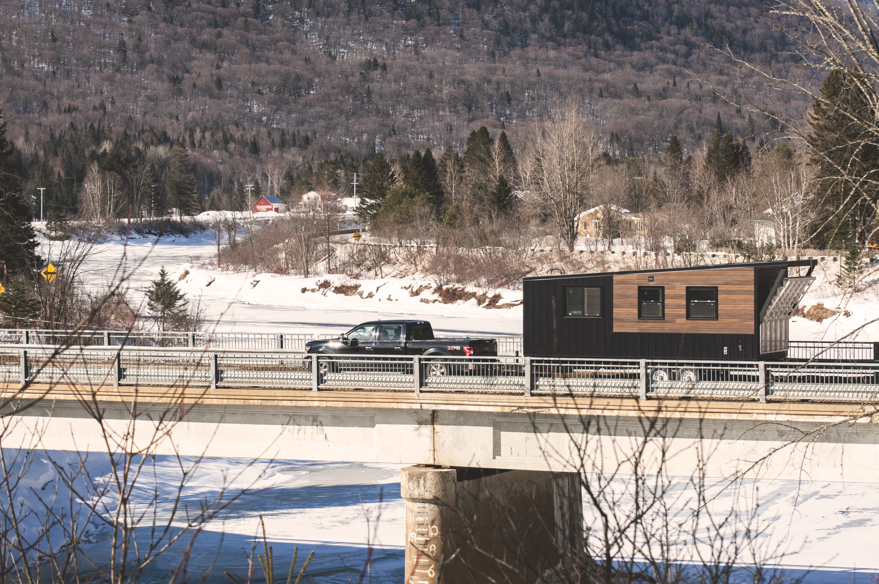 The Nomad is based on a double-axle trailer and is accessed by a motorized folding deck area at its rear 