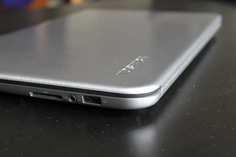 It includes an SD card slot and three USB ports