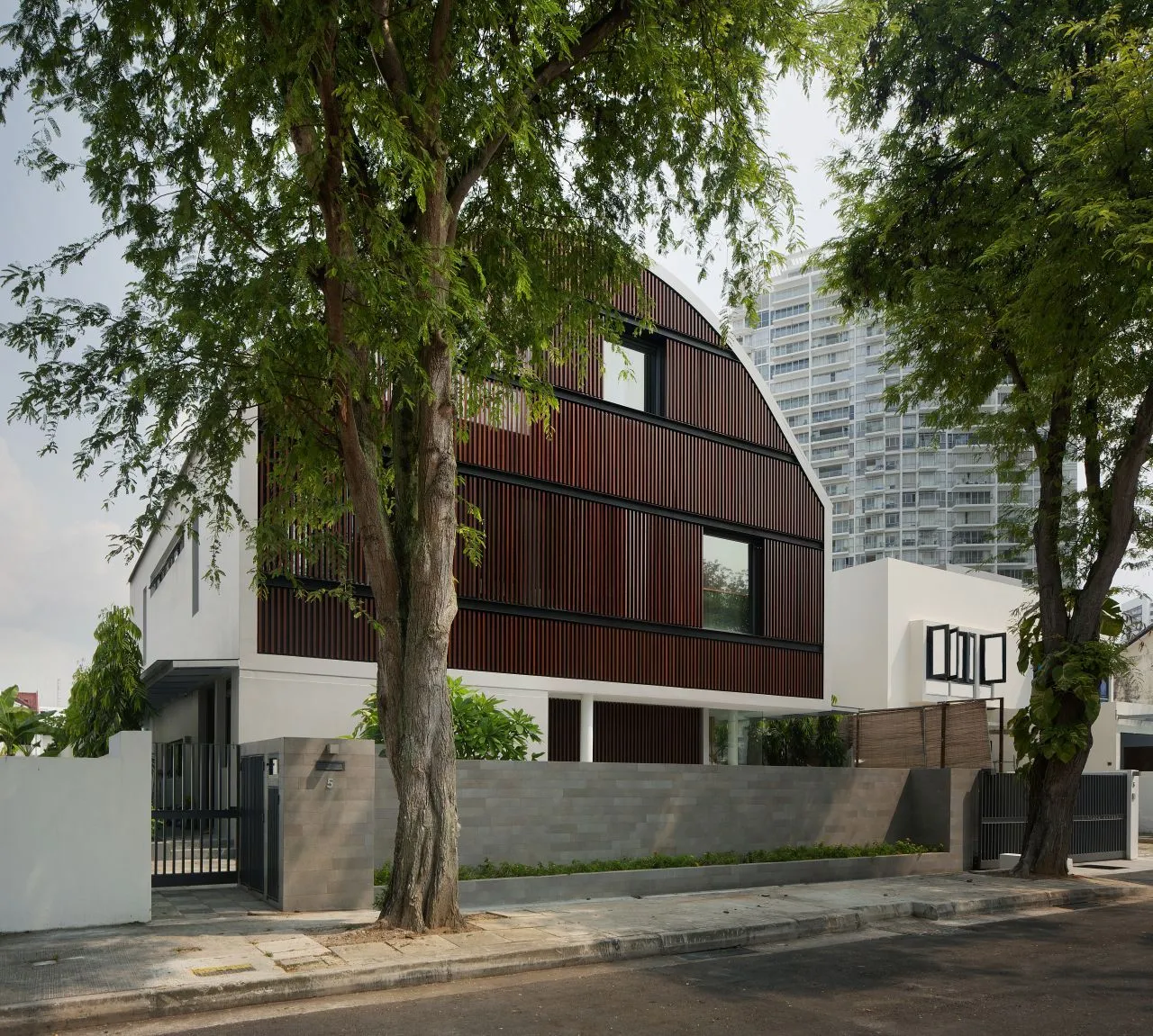 The two-story (plus attic) property is raised on concrete tubes (Photo: Jeremy San)