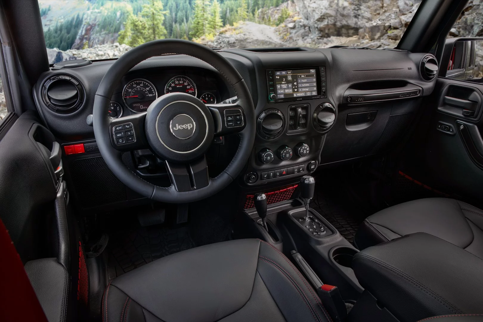 Also added to the 2018 Wrangler's interior are creature comforts like a usable arm rest between the front seats, more head and leg room, and an easier-to-use soft top