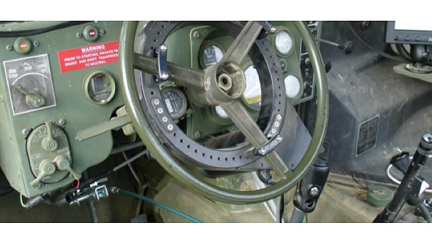 The Pronto4 installed on the steering wheel of a military vehicle
