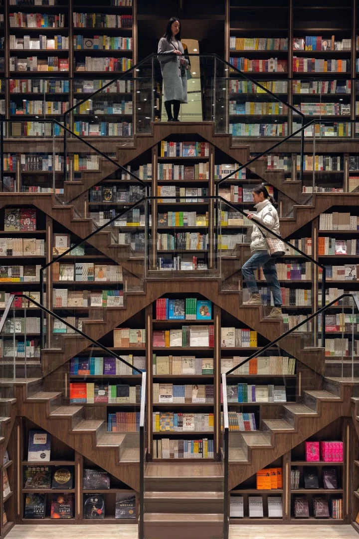 Staircases double as bookshelves inside the Chongqing Zhongshuge Bookstore