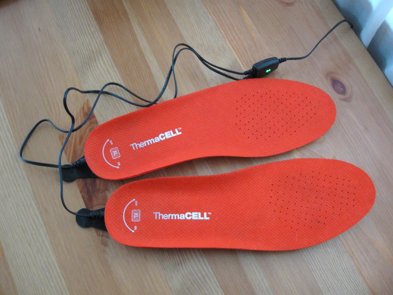 A complete charge takes about four hours from empty, and the charger lets you know when it's done by shutting off its green "on" light