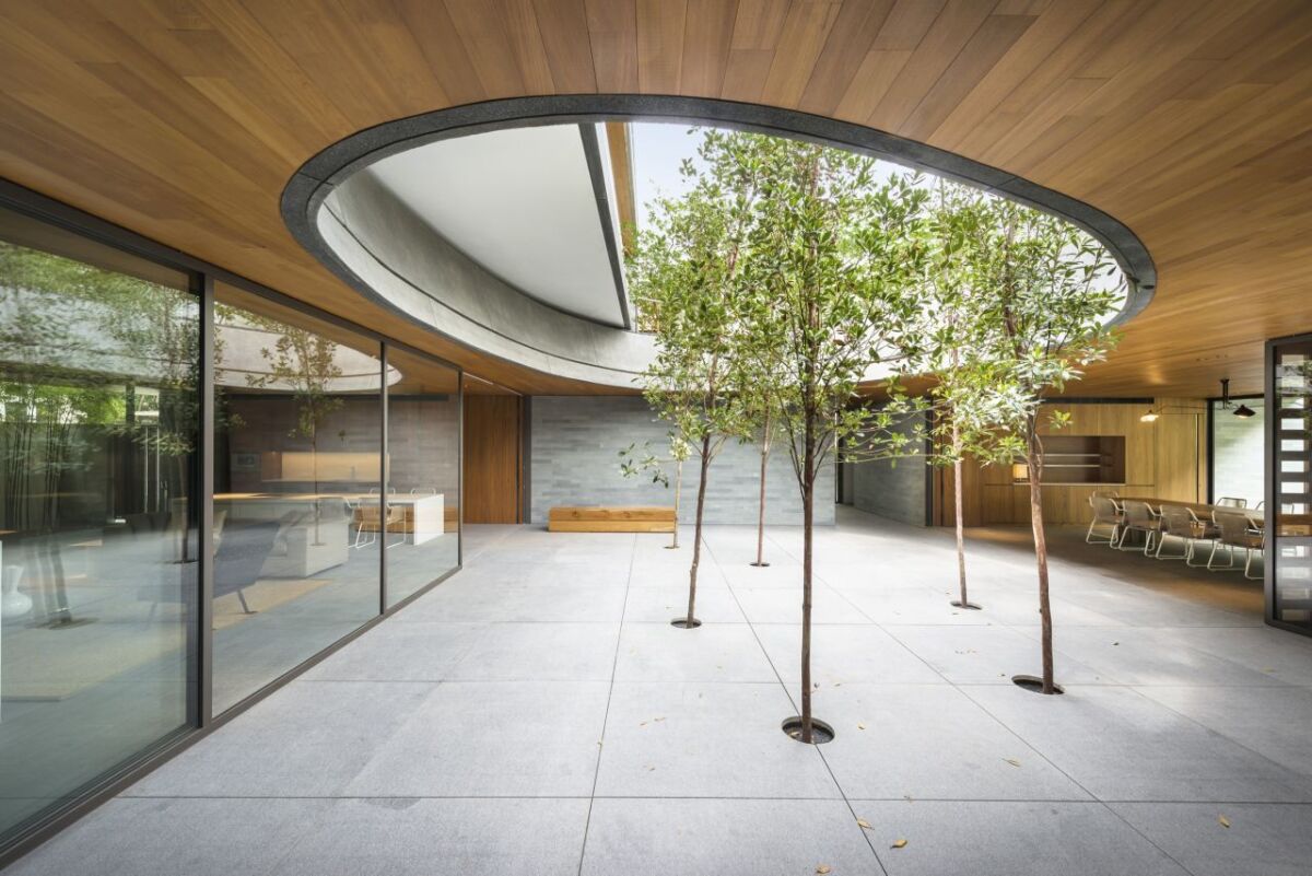 A shared courtyard and pool offer spaces for the family to come together (Photo: Bryan van der Beek and Edward Hendricks)