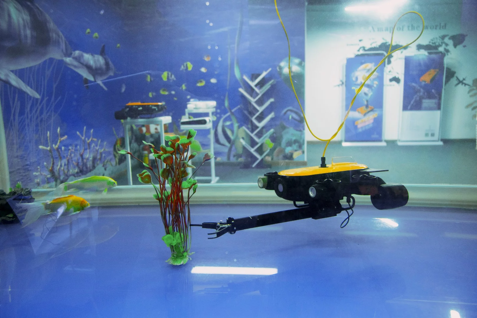 The Titan's manipulator arm is demonstrated in a water tank at CES