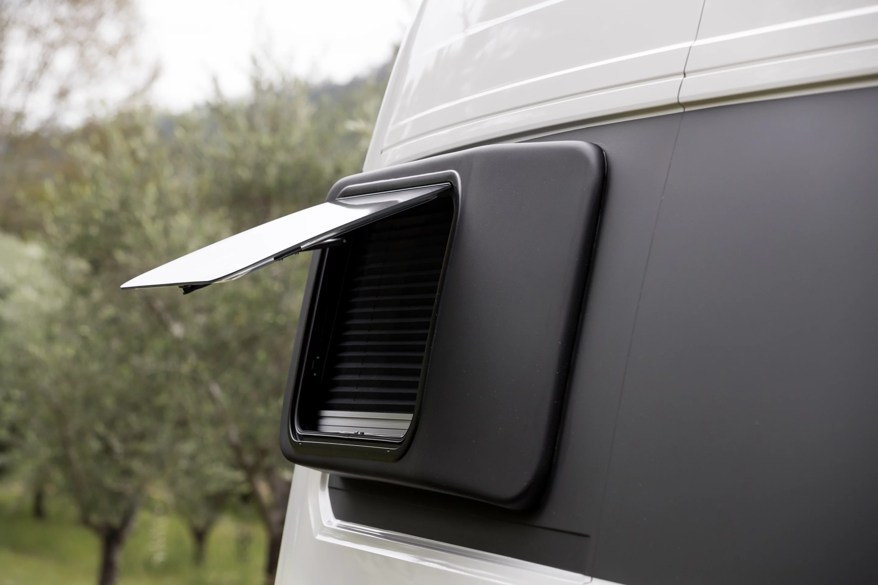 Windows built into the bed extension pods aren't something that every conversion shop offers, but Trakka integrates them into the Akuna design