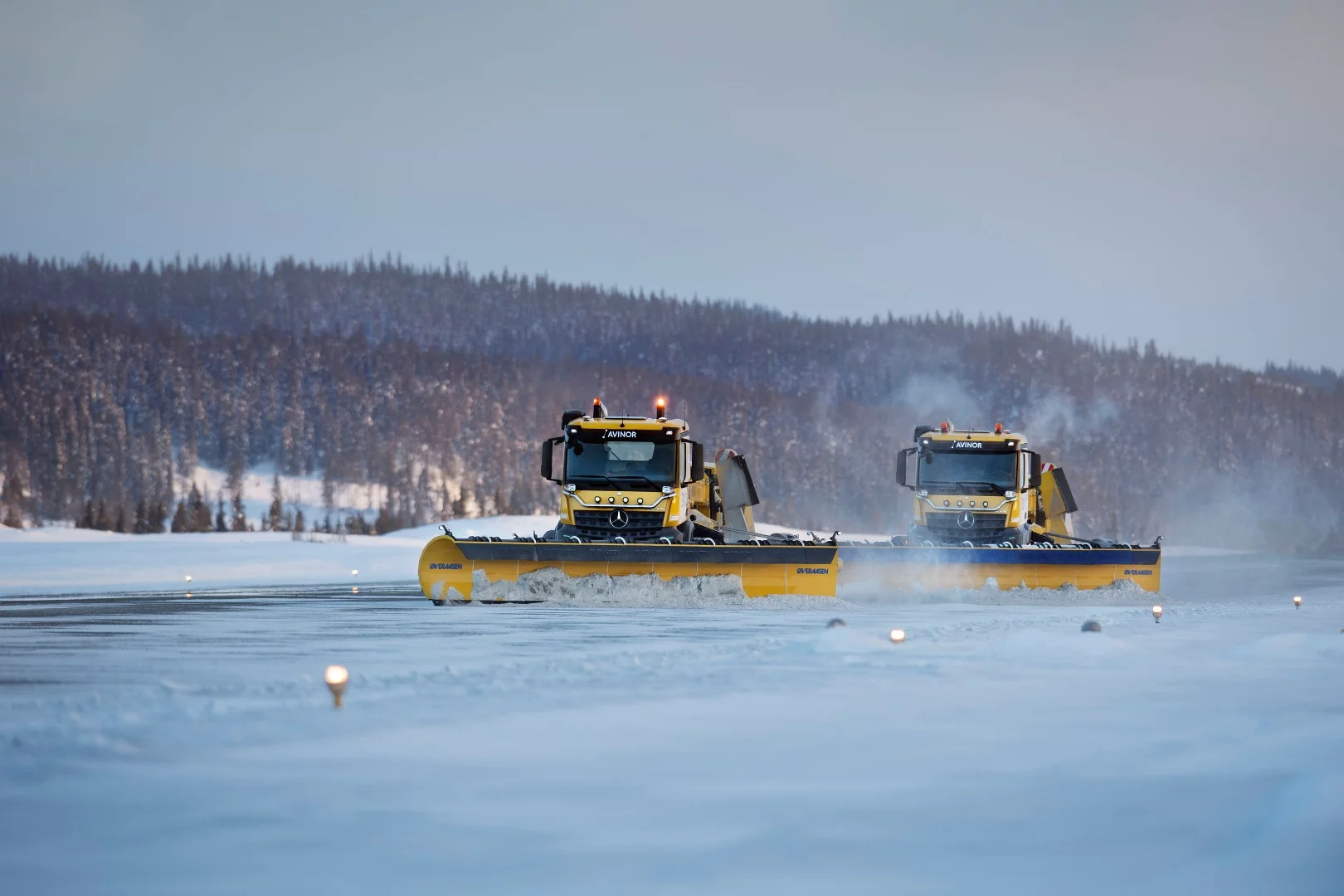 Two Yeti autonomous snowplows clearing a runway