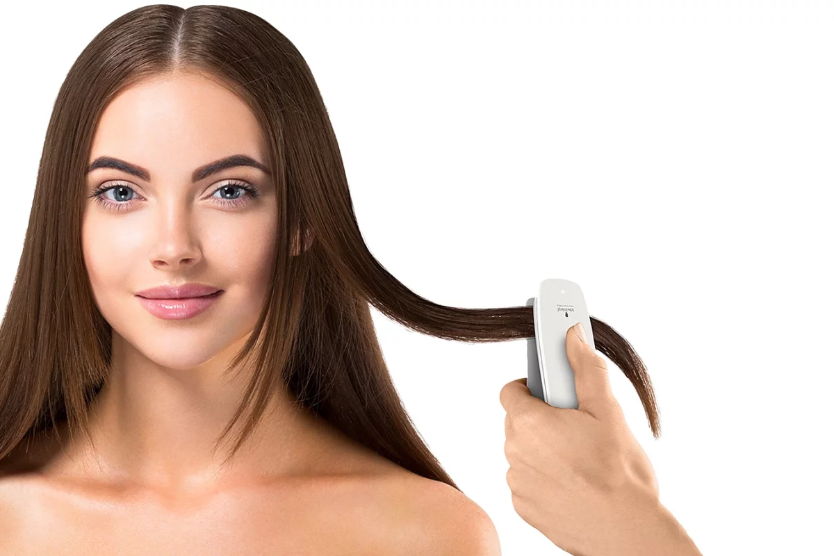 The SalonLab Analyzer is used to scan the client's hair