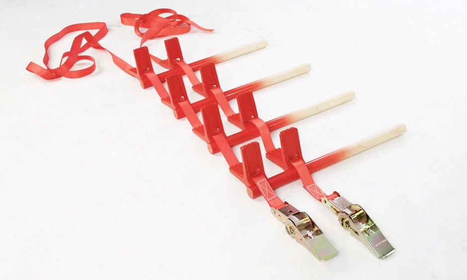 The Stooler consists of four wooden legs and metal ratchet buckles that tie around the material you want to convert into a chair