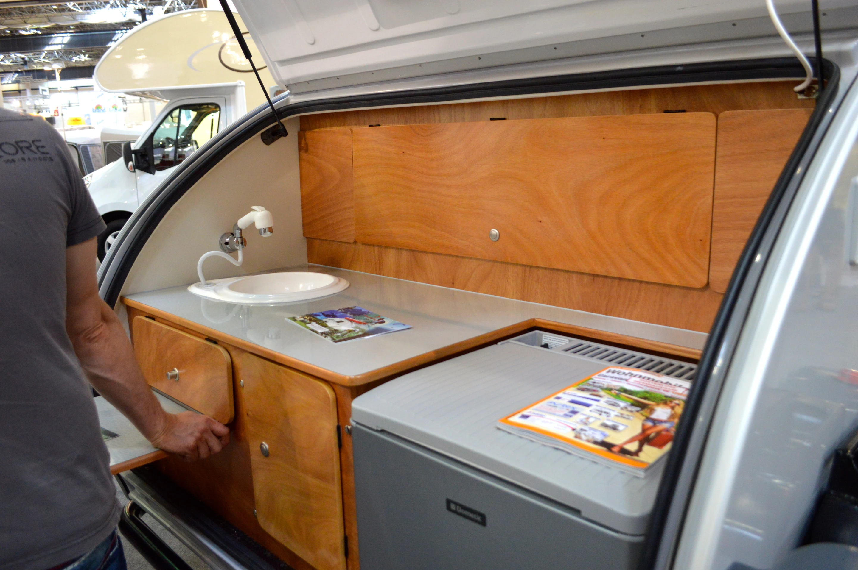 The available refrigerator and water system are stored in the trunk