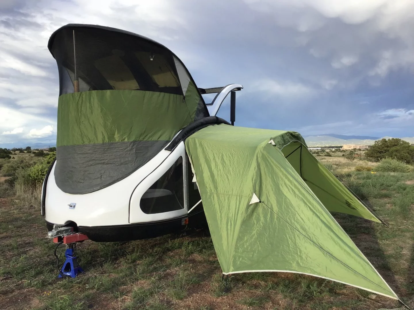 The available front tent turns the Earth Traveler teardrop into a roomier trailer with standing room
