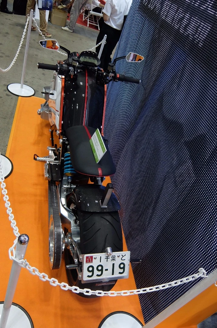 The direct rear view shows the large off-set to the rear belt drive