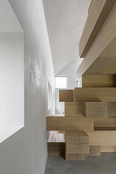 Studio Farris Architects also inserted a new structure within the building itself, placing a new shell within the building, offering a uniform look and a more insulated interior