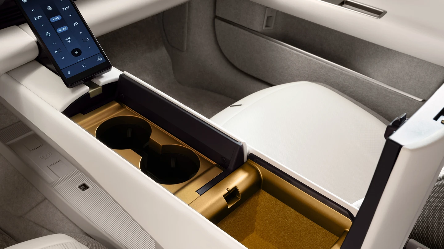 The high central console runs the length of the cockpit and includes a smartphone-style controller for climate control