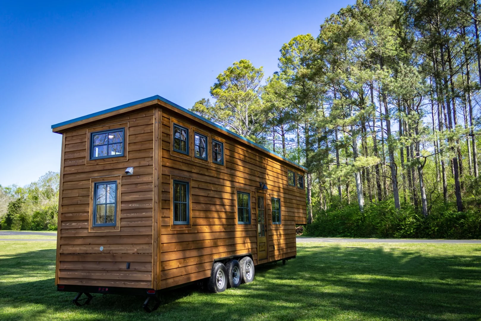 The Cedar House is topped by a blue standing seam metal roof