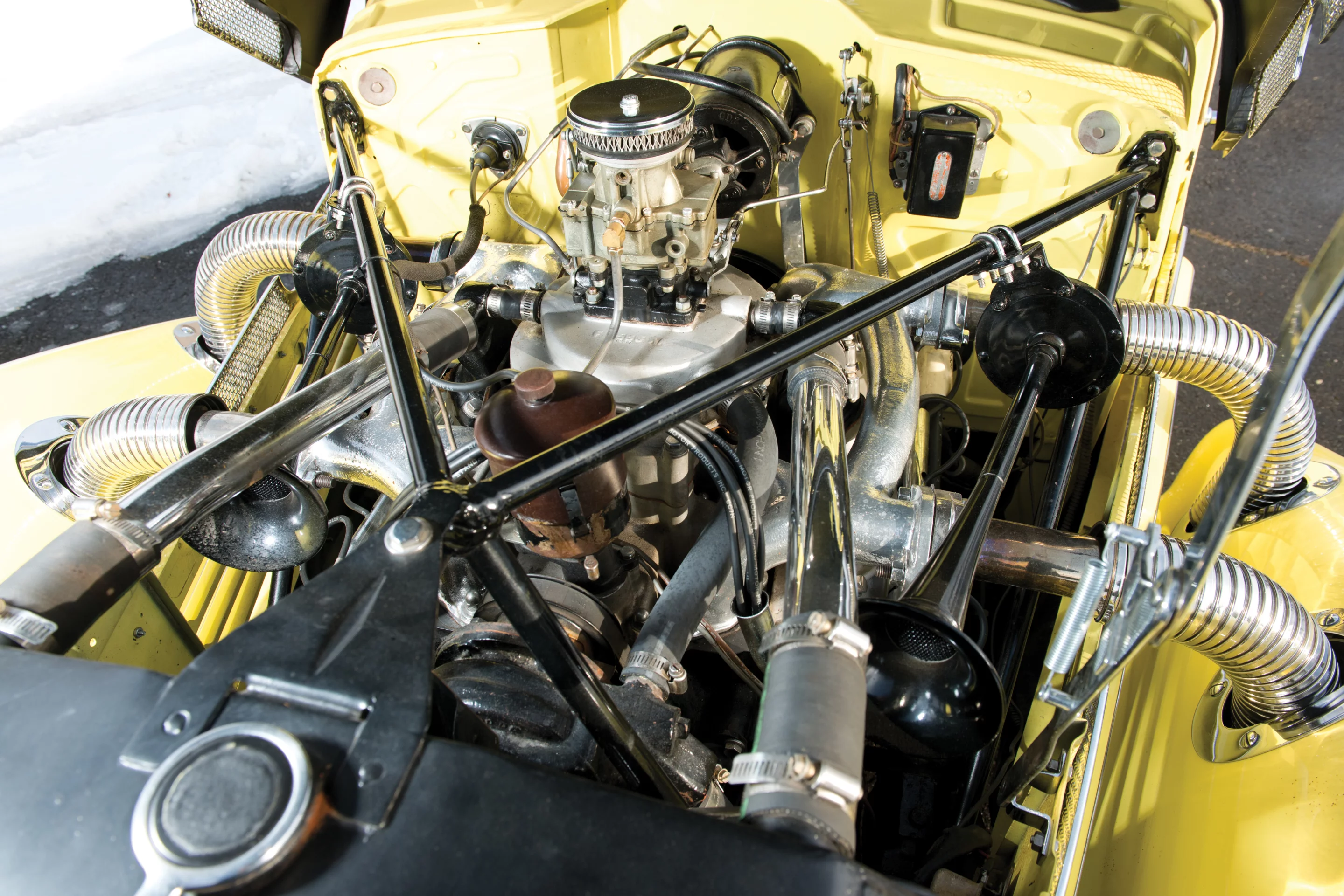 The Cord runs on a 190 bhp, 288 cu. in. supercharged L-head V-8 and a four-speed pre-selector manual transmission