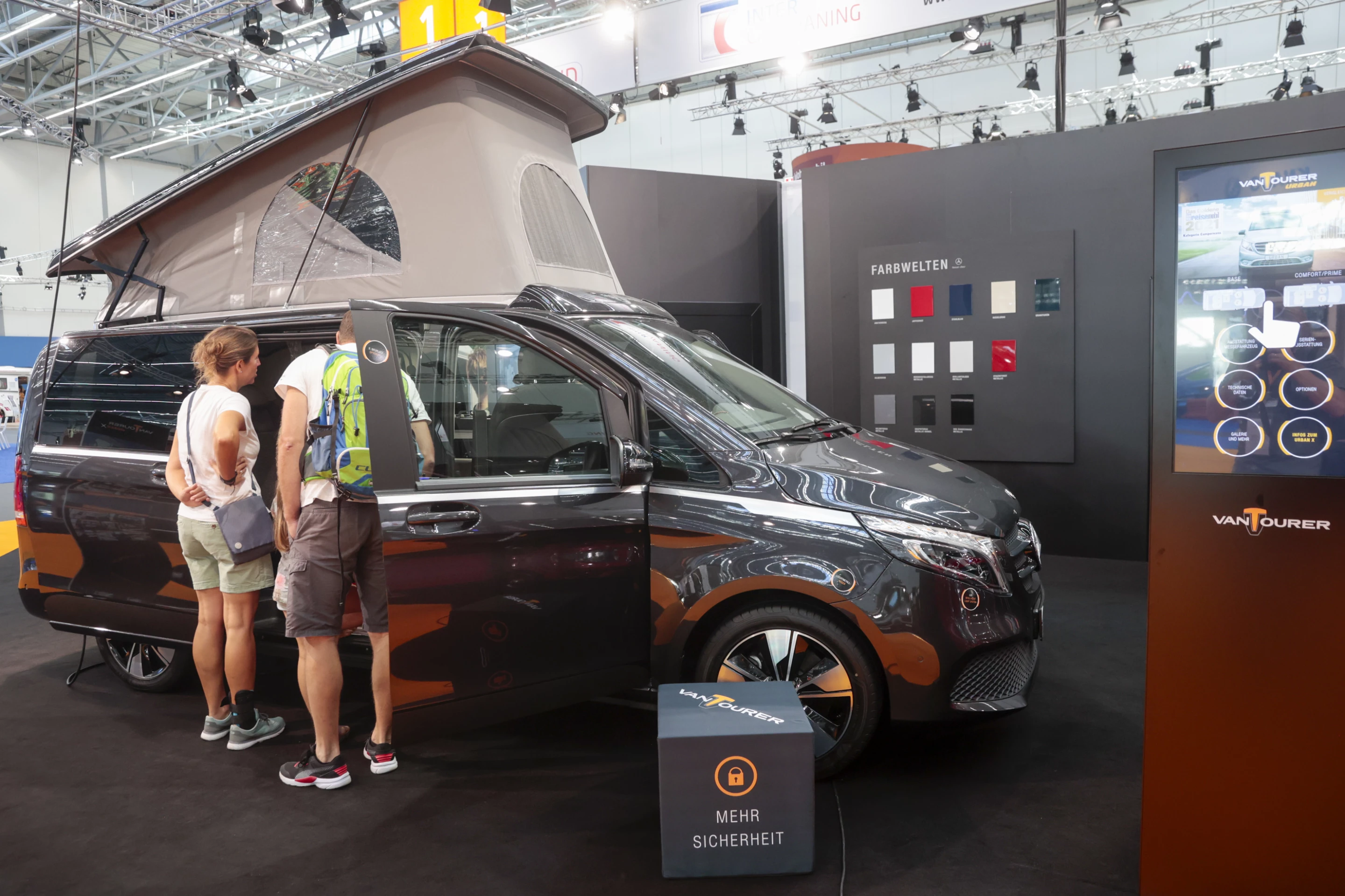 Caravan Salon attendees scope out the flexible interior of the VanTourer Urban X