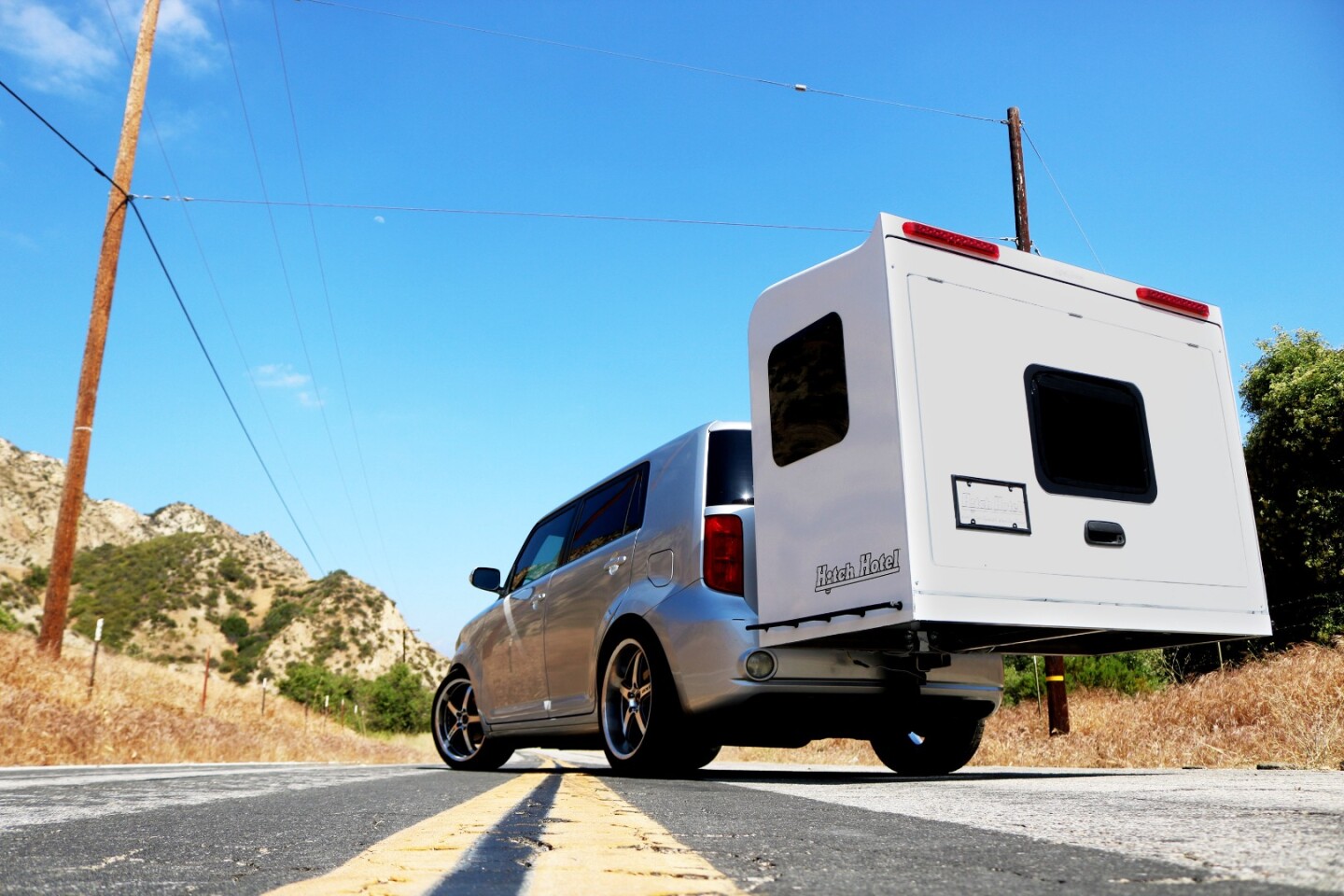 The Hitch Hotel compacts small and light enough that it doesn't need wheels - it just rides on the vehicle hitch