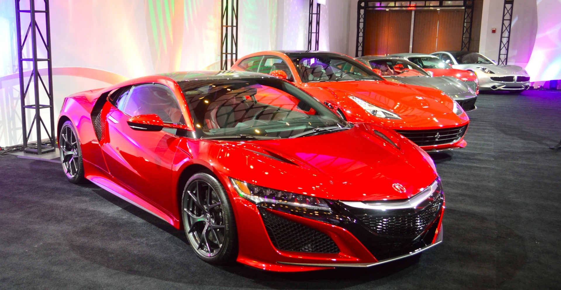 Exotics all lined up outside the Detroit media room