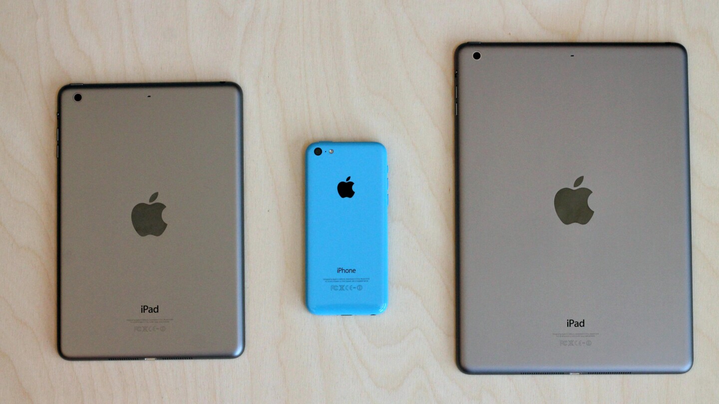 The iPhone 5c next to the iPad mini with Retina Display and iPad Air
