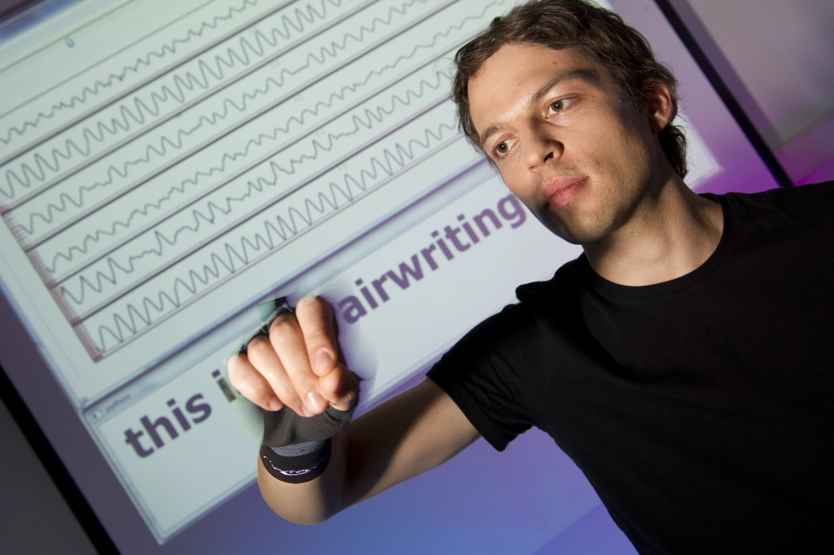 In the airwriting system, a sensor-equipped glove is used to identify letters drawn in the air by the wearer, which are then converted into digital text