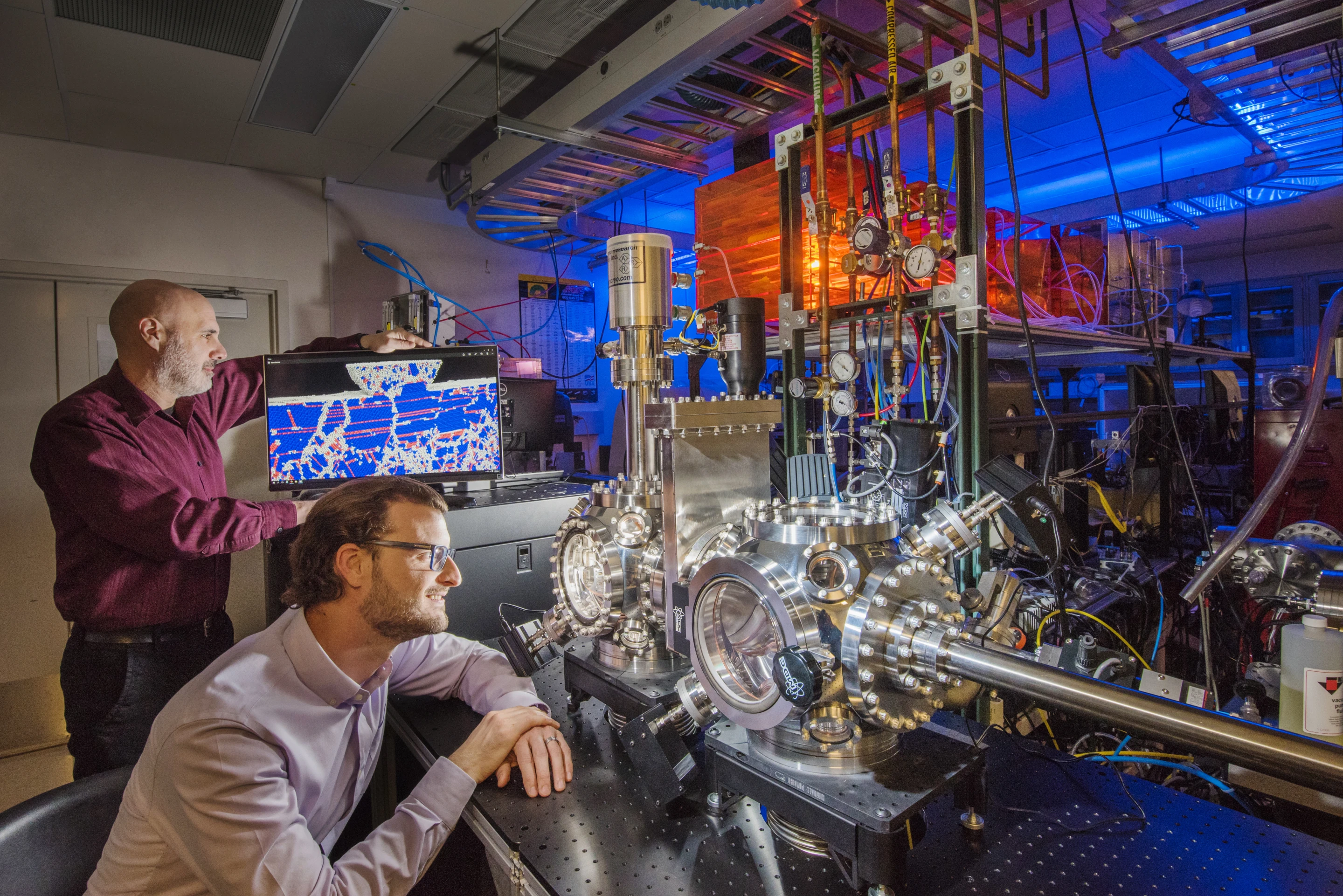 Sandia researchers Michael Chandross (left) and Nic Argibay, overseeing the testing of the platinum-gold alloy that's now the world's most durable alloy