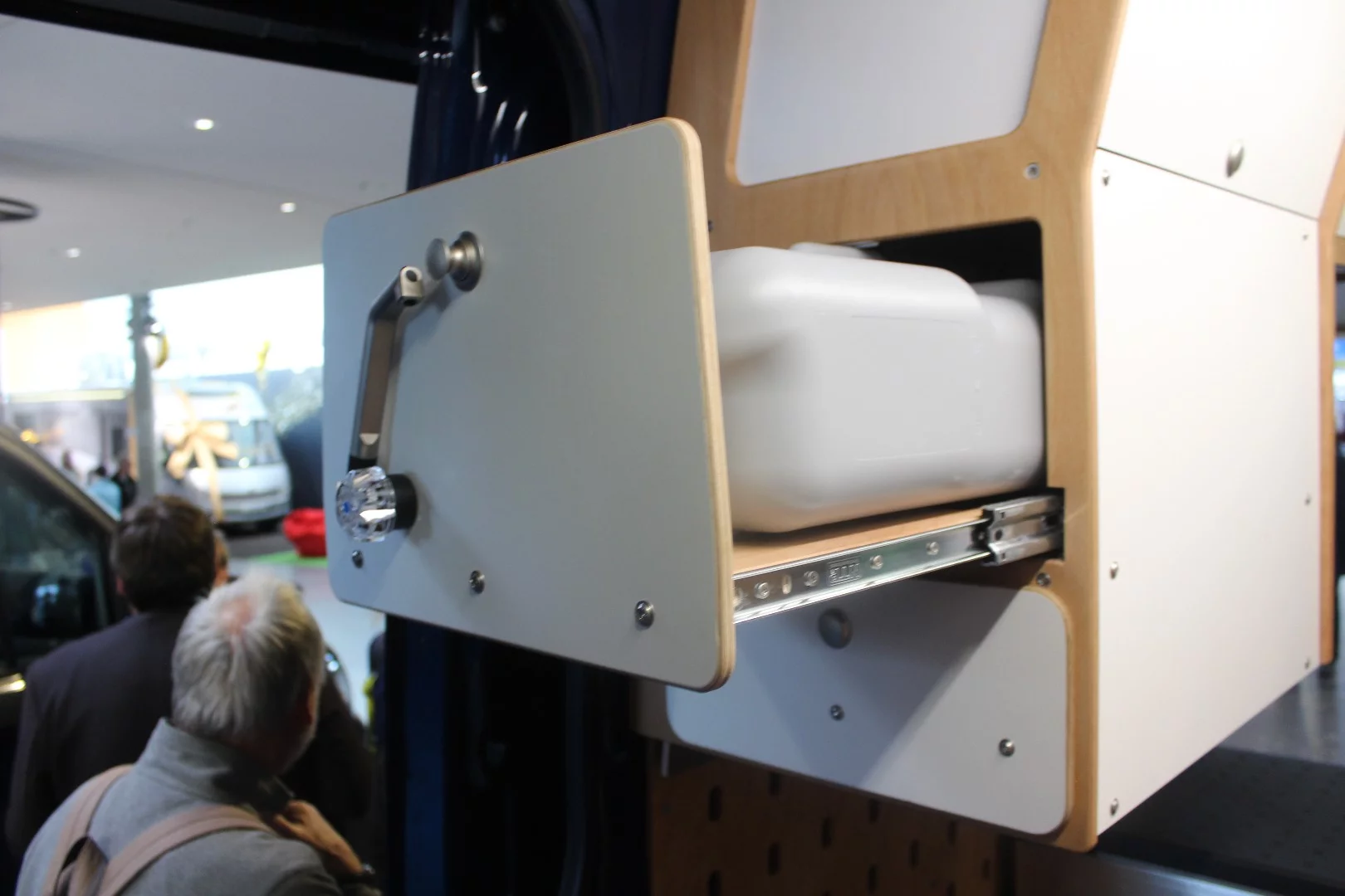 The kitchen module on the show van has a water drawer with swivel faucet