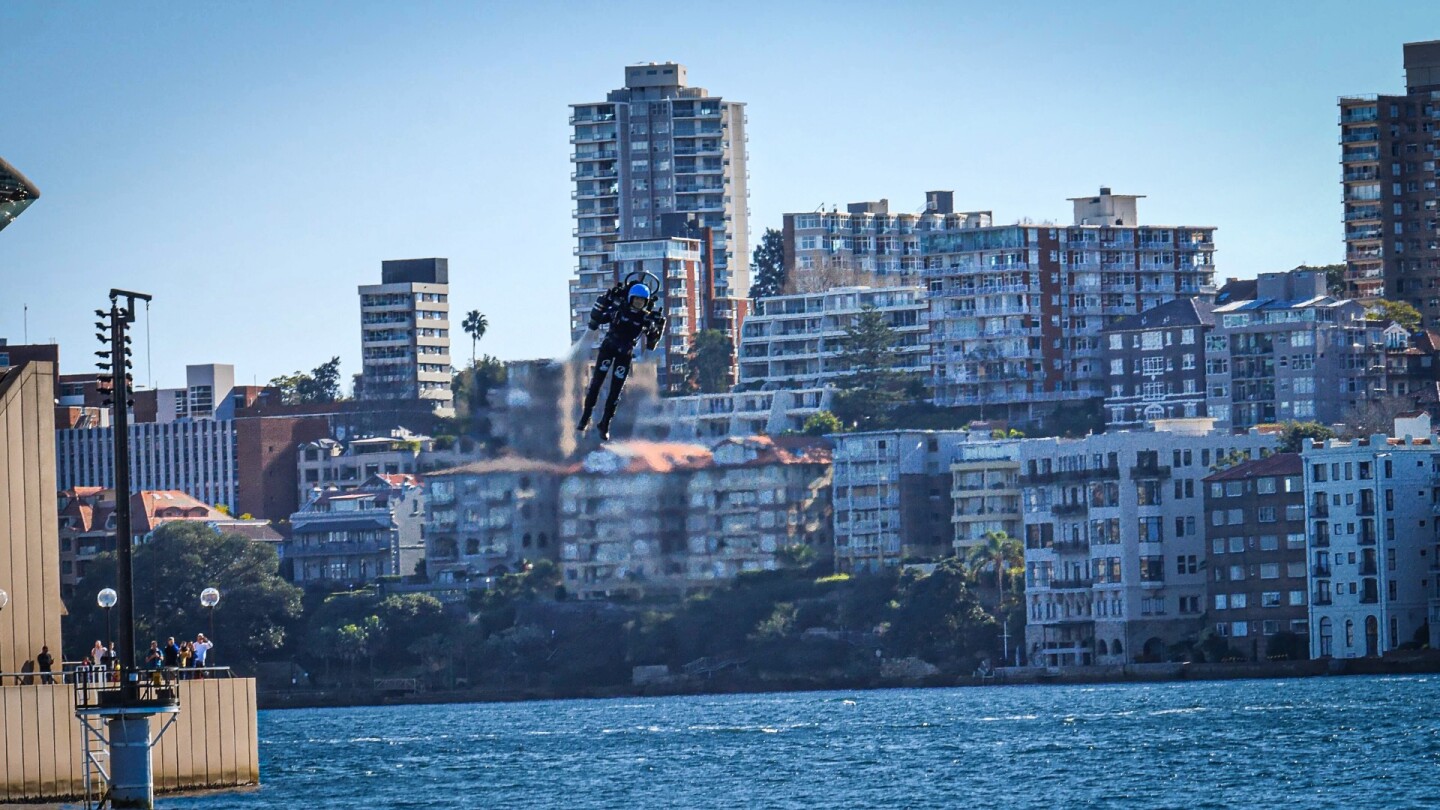 The North Shore of Sydney Harbour makes a terrific background for Mayman as he rides his extraordinary creation