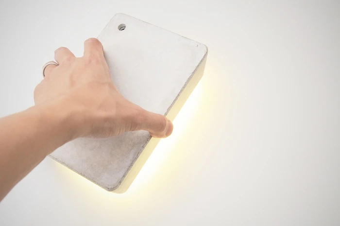 Brick Lamp is designed to be tactile, as lifting it acts as the On/Off switch