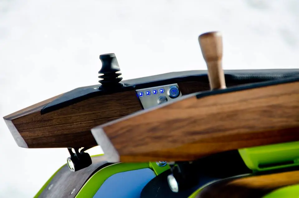 Steering is managed using a single armrest-mounted joystick