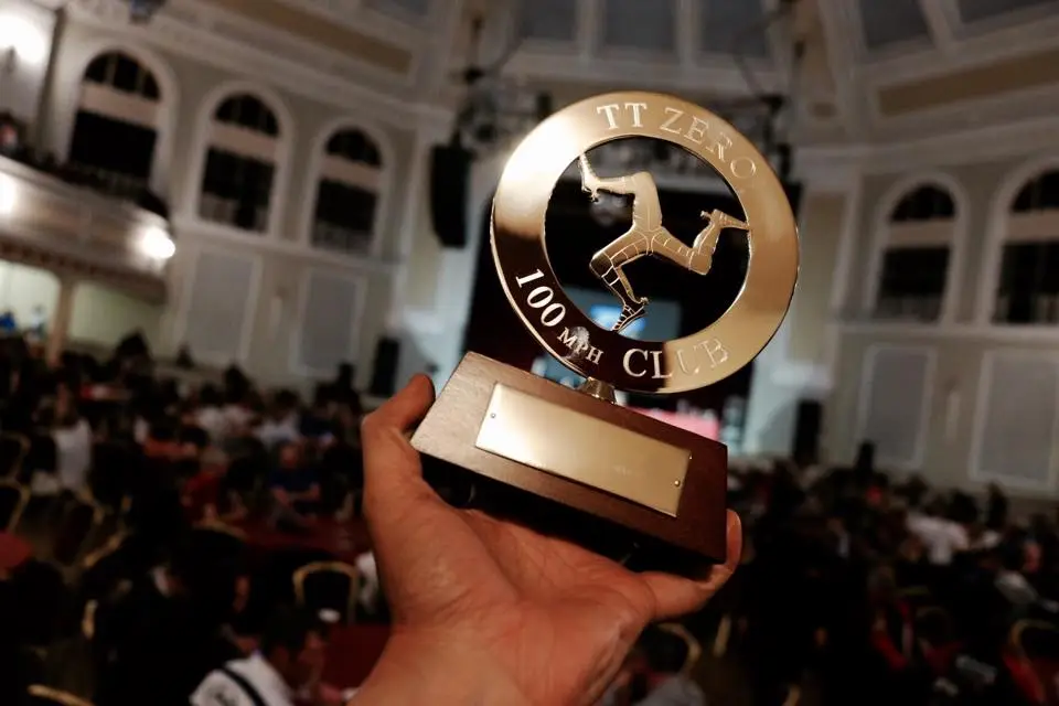 Team Sarolea proudly display an important trophy they take home from the 2015 TT Zero Challenge: A full membership to the 100 mph Club
