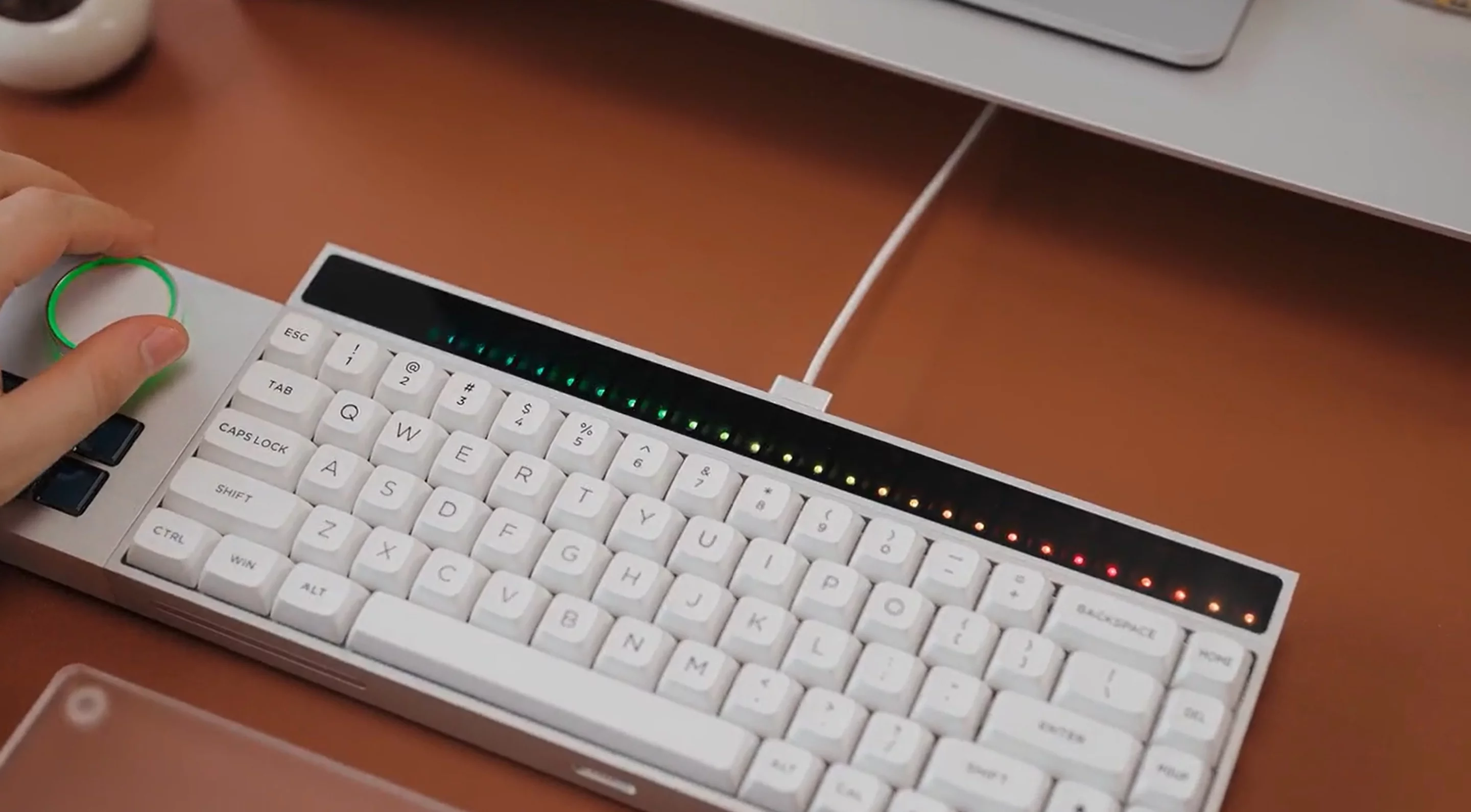 The controller module features a multi-function knob and six user-assignable hotkeys, while the touch bar shown here is dependent on the Kickstarter campaign reaching a stretch goal