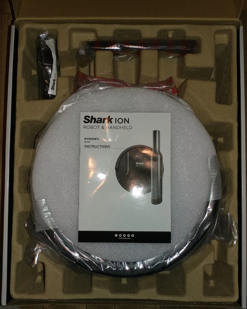 Opening the carryon-sized product box, one will find organized trays of individual parts and accessories and simple pictorial instructions for assembling the Shark Ion